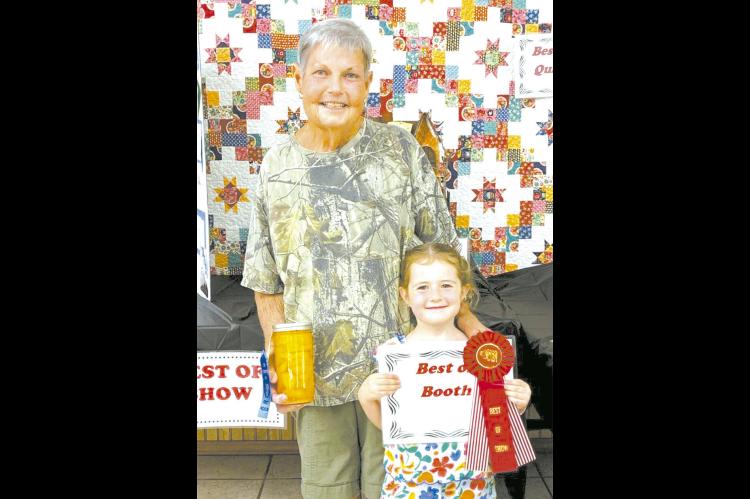 Best of Show in Coal County OHE Booth - Tammy Shirley with granddaughter Zula Darling