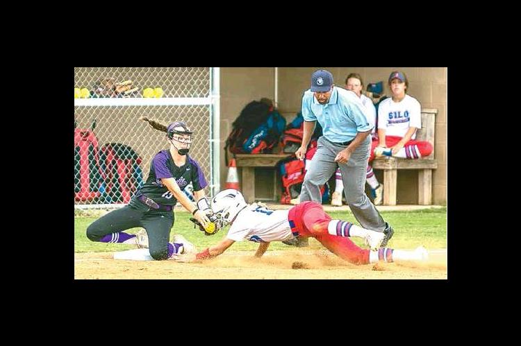 —Photo by Sherry Loudermilk CLASS 2A STATE SOFTBALL TOURNAMENT (COALGATE VS SILO) - Lady Cat sophomore shortstop Kenley Thompson #15 covers third base and tags a Silo player.