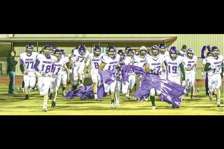 —Photo by Sherry Loudermilk COALGATE VS KINGSTON — The Coalgate Wildcats make their debut onto the Kingston Redskins football field