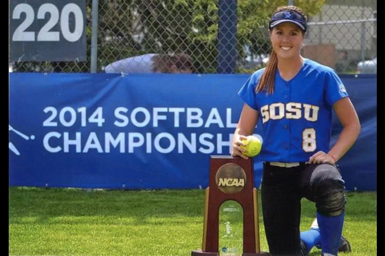 Laramie next to the NCAA District 1 Super Regional Championship trophy.
