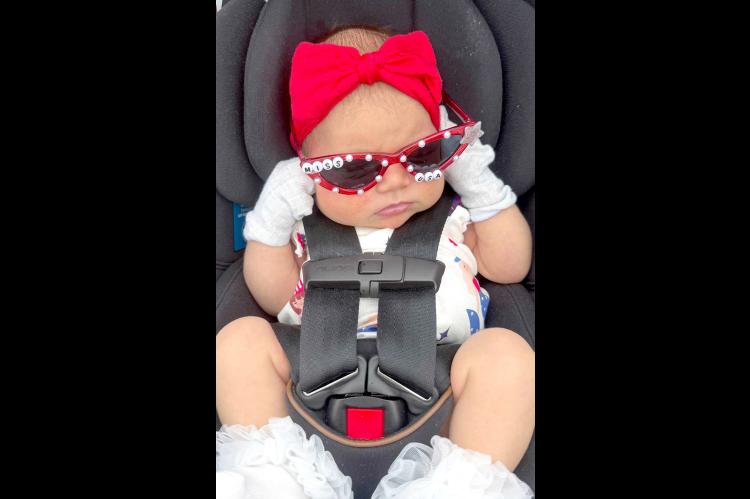 All dressed up for her first 4th of July is Motley Ann Peay, the daughter of Tommy and Macy Peay and granddaughter of Justin and Monica Farris.