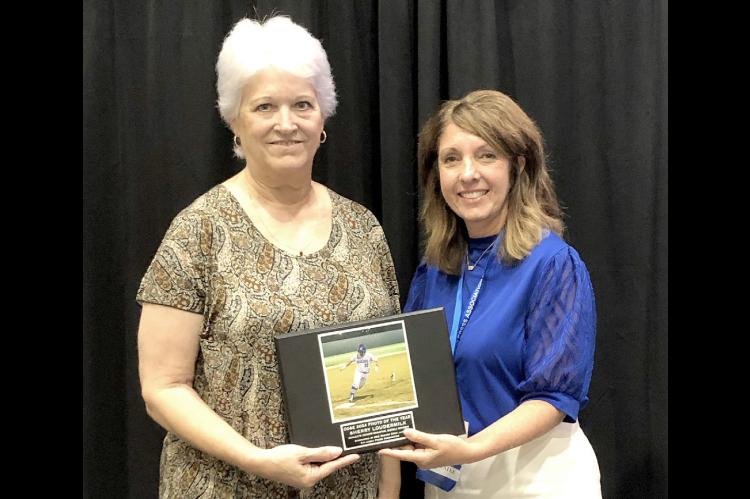 Our Photographer of the Year is pictured above receiving her award from the Oklahoma Press Association President, Shawna Belyeu, at the luncheon Saturday. Her picture (at right) was displayed on the big screen during the presentation.