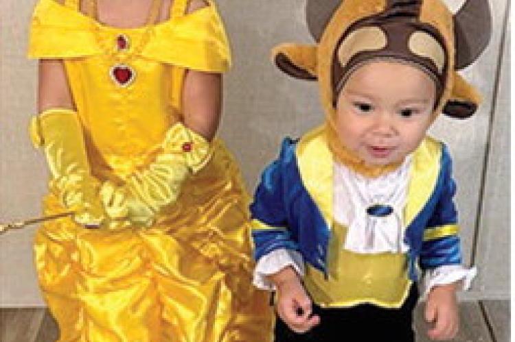 Happily ever after, Halloween-style: Reikyn and Lennon Griffith, the children of Peydon and Sidney Griffith, charmed trick-or-treaters as Beauty and the Beast.
