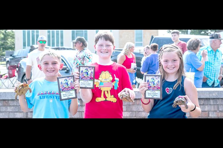 MEET YOUR 2026 COALGATE INDEPENDENCE DAY TURTLE RACE WINNERS... Pictured L-R:3rd Place Jett Griffin, 2nd Place Braylin Grant, 1st Place Braelynn Cooksey. Picture Courtesy of Sherry Loudermilk