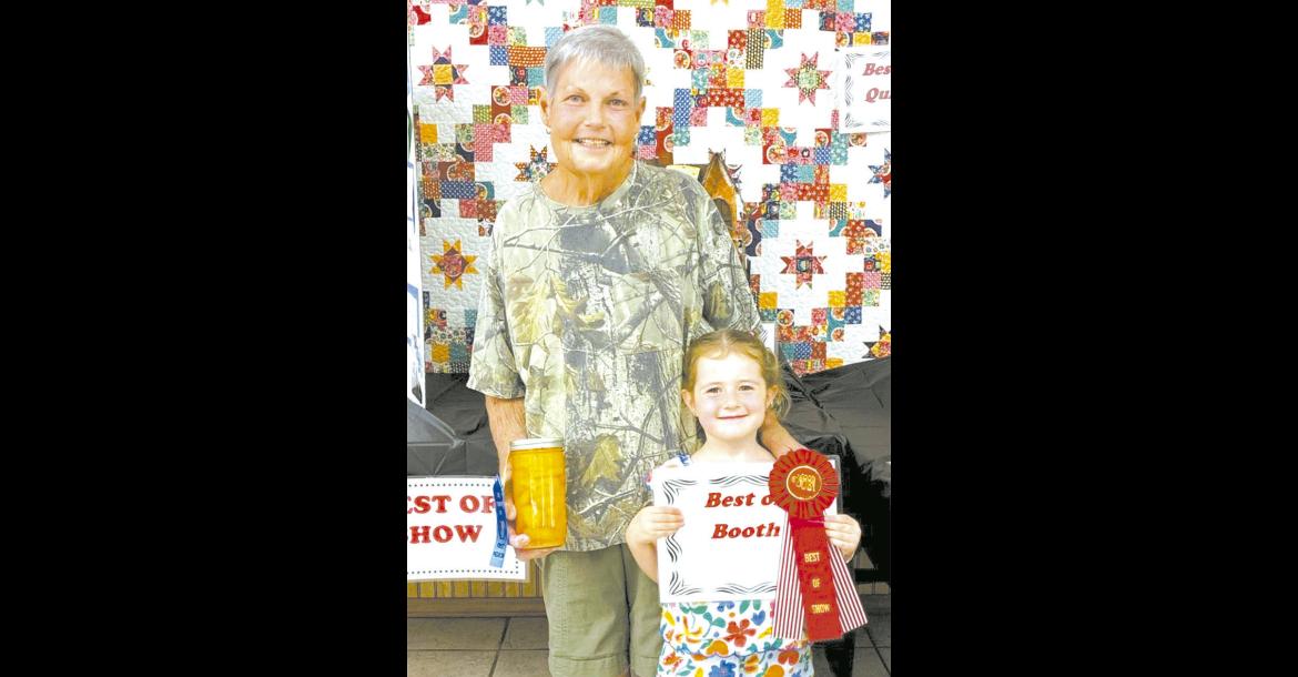 Best of Show in Coal County OHE Booth - Tammy Shirley with granddaughter Zula Darling