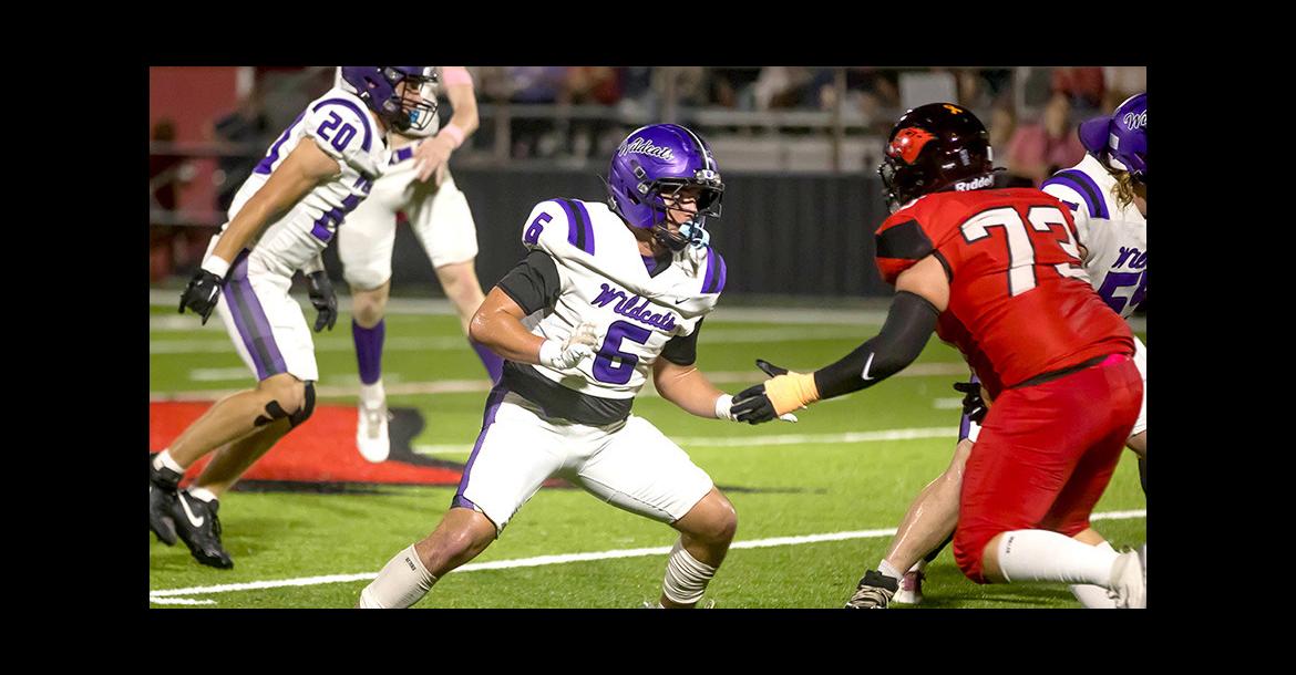 Tag, you’re it! Jase Burris eyes the opp.