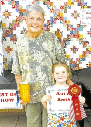 Best of Show in Coal County OHE Booth - Tammy Shirley with granddaughter Zula Darling
