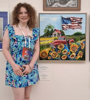 Candi Ford standing beside her painting at the Cannon Tunnel Gallery of the United States Capitol.