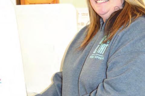FIRST TIME VOTER — First time voter Kaylie Burleson marks her ballot in the Presidential Preferential Primary Election during the early voting period on Friday, March 28. Kaylie is the Coal County Election Board Assistant Secretary.