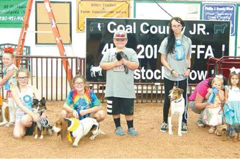 COAL COUNTY FAIR PET SHOW — Dixie Hensley with Sheba; Kristy Coats with Dixie; Kirsten Haney with Roxy; Jaxton Fortner with Dusty; Reagan Carter with Trip; Karsyn Faulkenberry with Jax; and Zailyn Lampkin with Sam (and helper Stacia Coats), from left