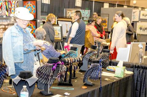 Patrons browse First American artwork at the annual Hushtola Art Market.