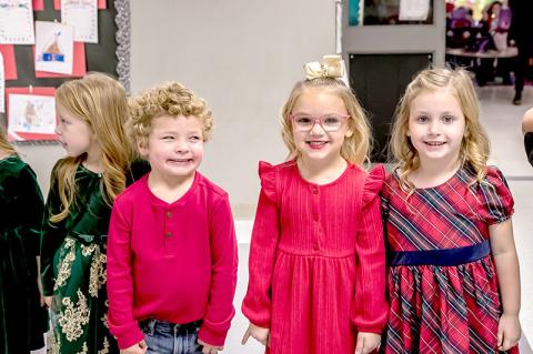 Madison Riley, Bentley Sharp, and Skylar Blue dressed in their Christmas best for Christmas at Emerson Elementary.