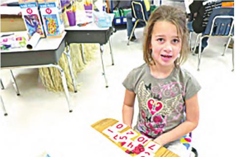 Serenity Walton in the Math Center counting up her critters.