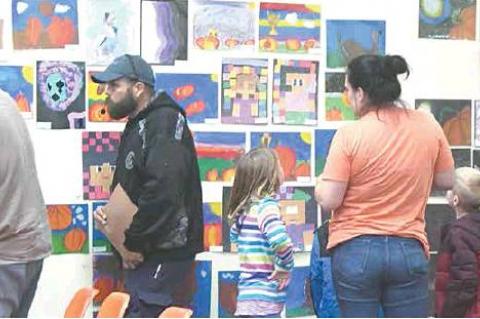 TUPELO ART SHOW — Families and community members flocked to the Tupelo Schools Art Show and Auction. All art pieces were made by students in kindergarten through twelfth grade.