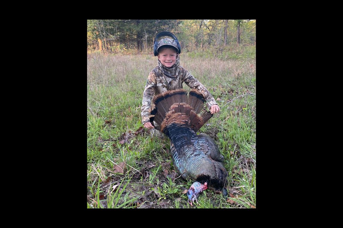YOUNG HUNTER BAGS HIS FIRST TURKEY